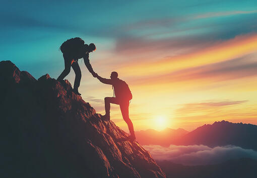 Two people climbing together, representing CTO-led guidance and support